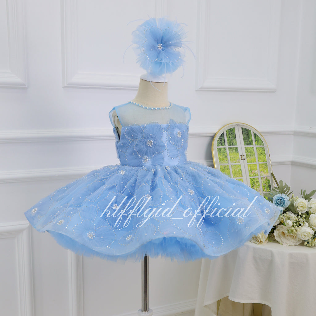 Baby blue floral princess gown for girls with dimensional flower details and a voluminous layered tulle skirt side view