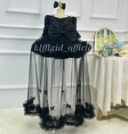 Black princess dress for girls with large back bow and flowing sheer tulle panels back view
