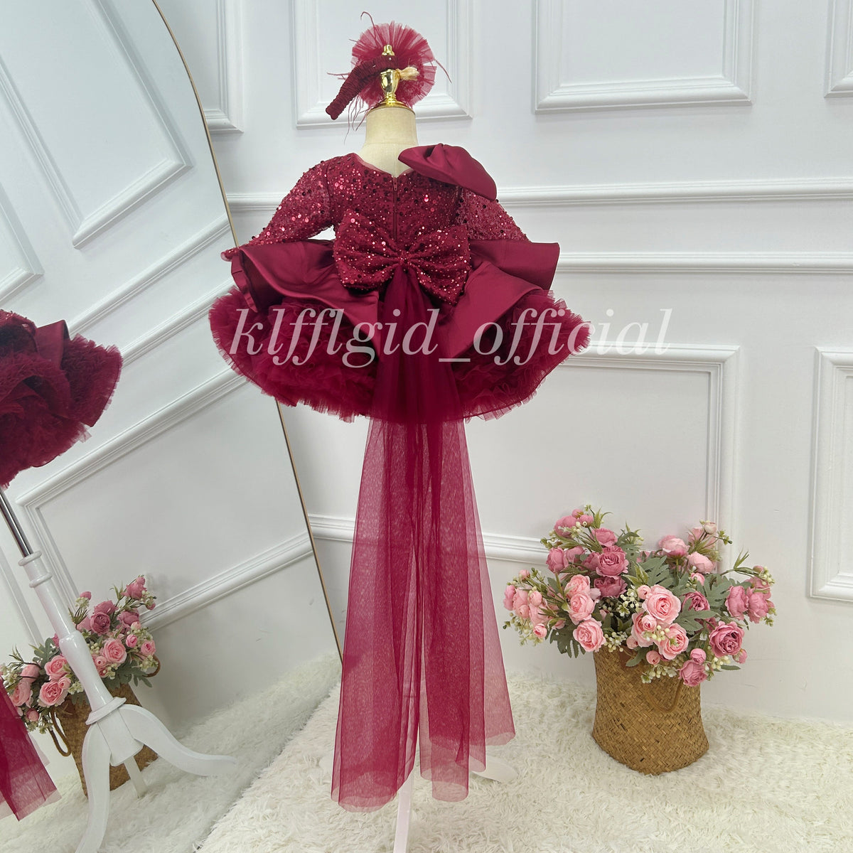 Burgundy girls princess dress back view with large bow detail and flowing tulle train