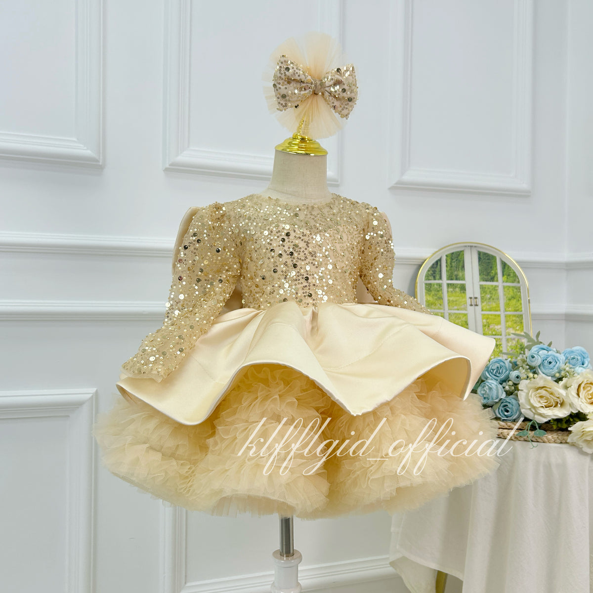 Champagne sparkly princess dress for girls with full tulle skirt and flowing sheer panels side angle