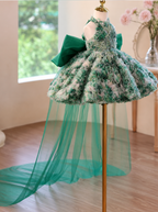 Emerald green floral tulle princess gown showing layered skirt texture and flowing train detail