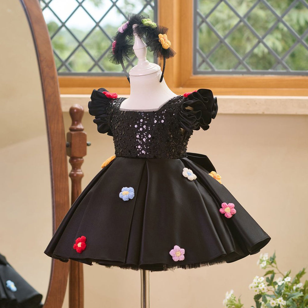Side view of black girls princess dress with sequin bodice and full skirt