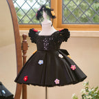 Side view of black girls princess dress with sequin bodice and full skirt