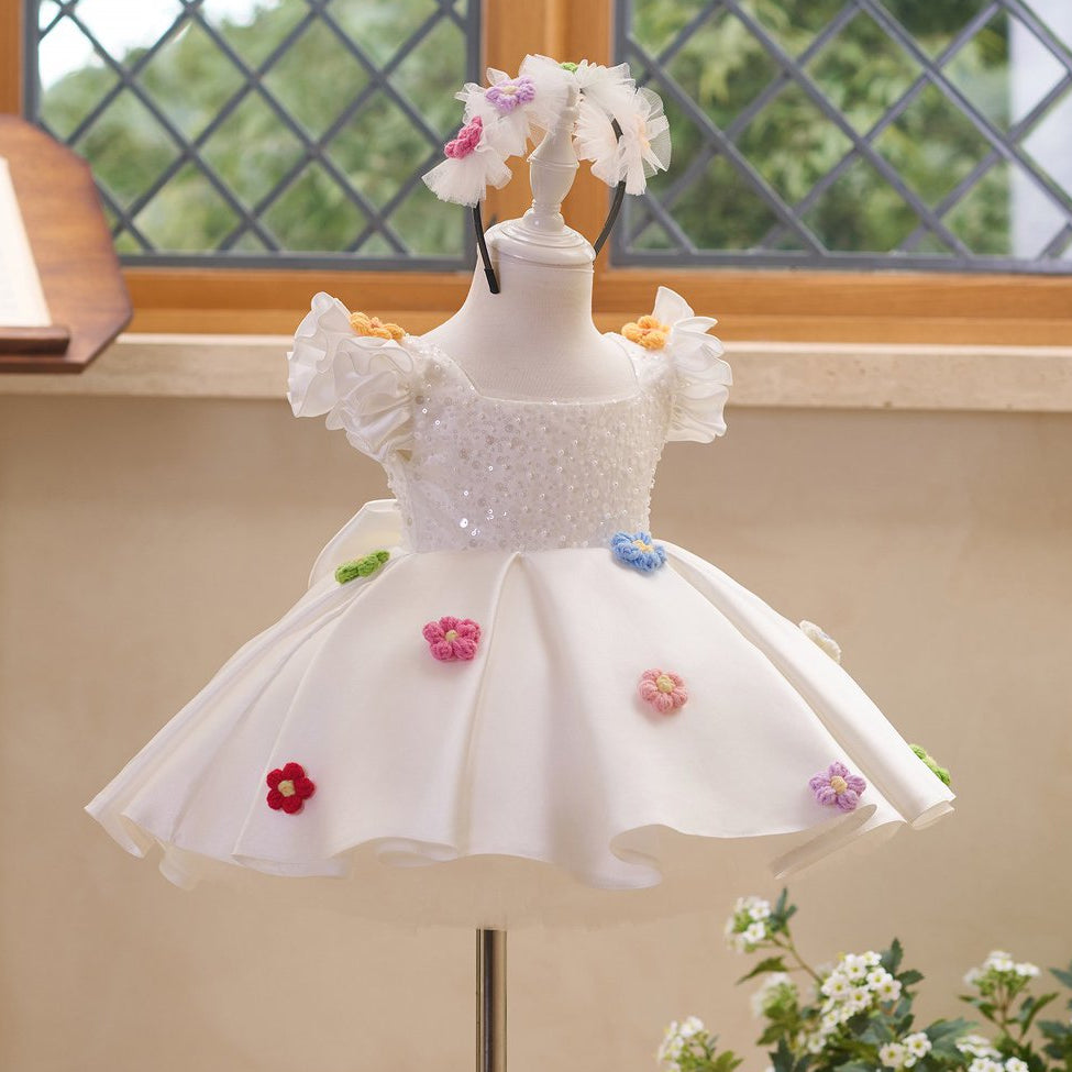 Side view of white girls princess dress with sequin bodice and full skirt