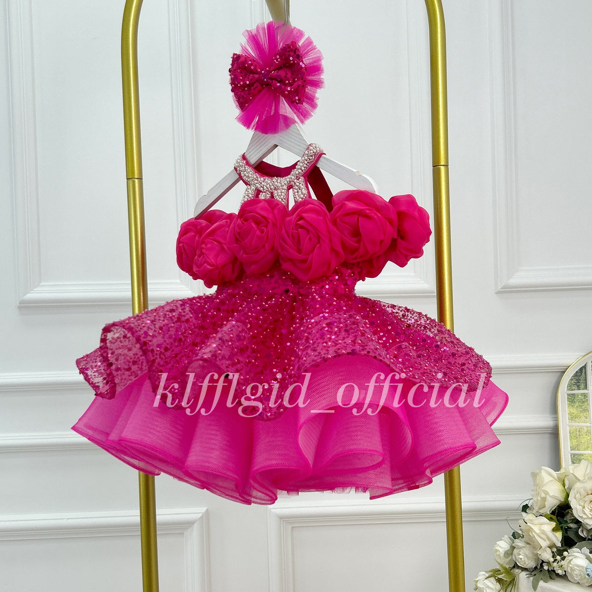 Hot pink sparkly princess dress for girls with full sequin tulle skirt and ruffled hem side view