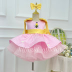 Front view of a pink girls' princess dress with a yellow waistband, bee appliqué on the bodice, daisy decorations, and a layered tulle skirt.