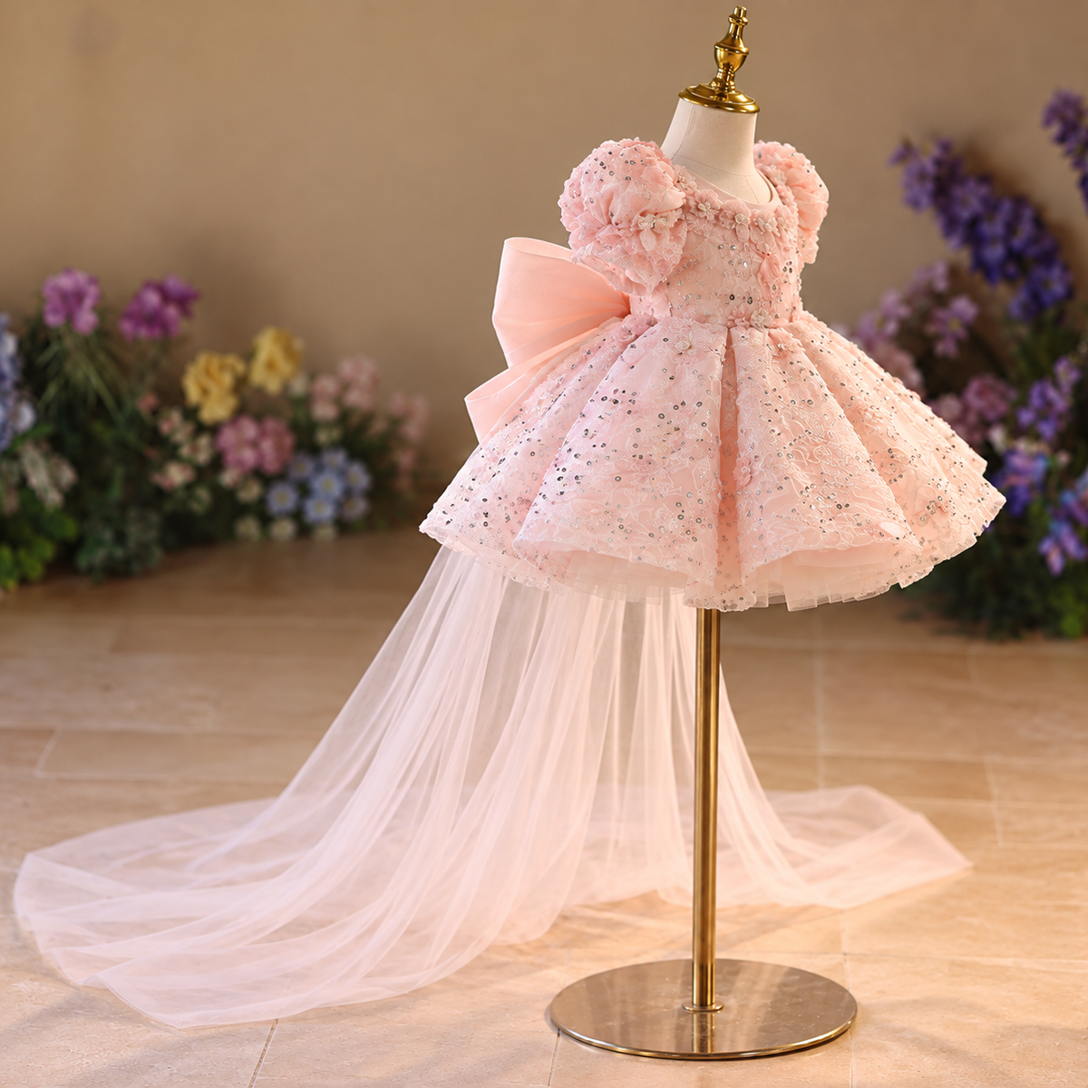 Side angle of pink sequin girls party dress with elegant layered tulle skirt