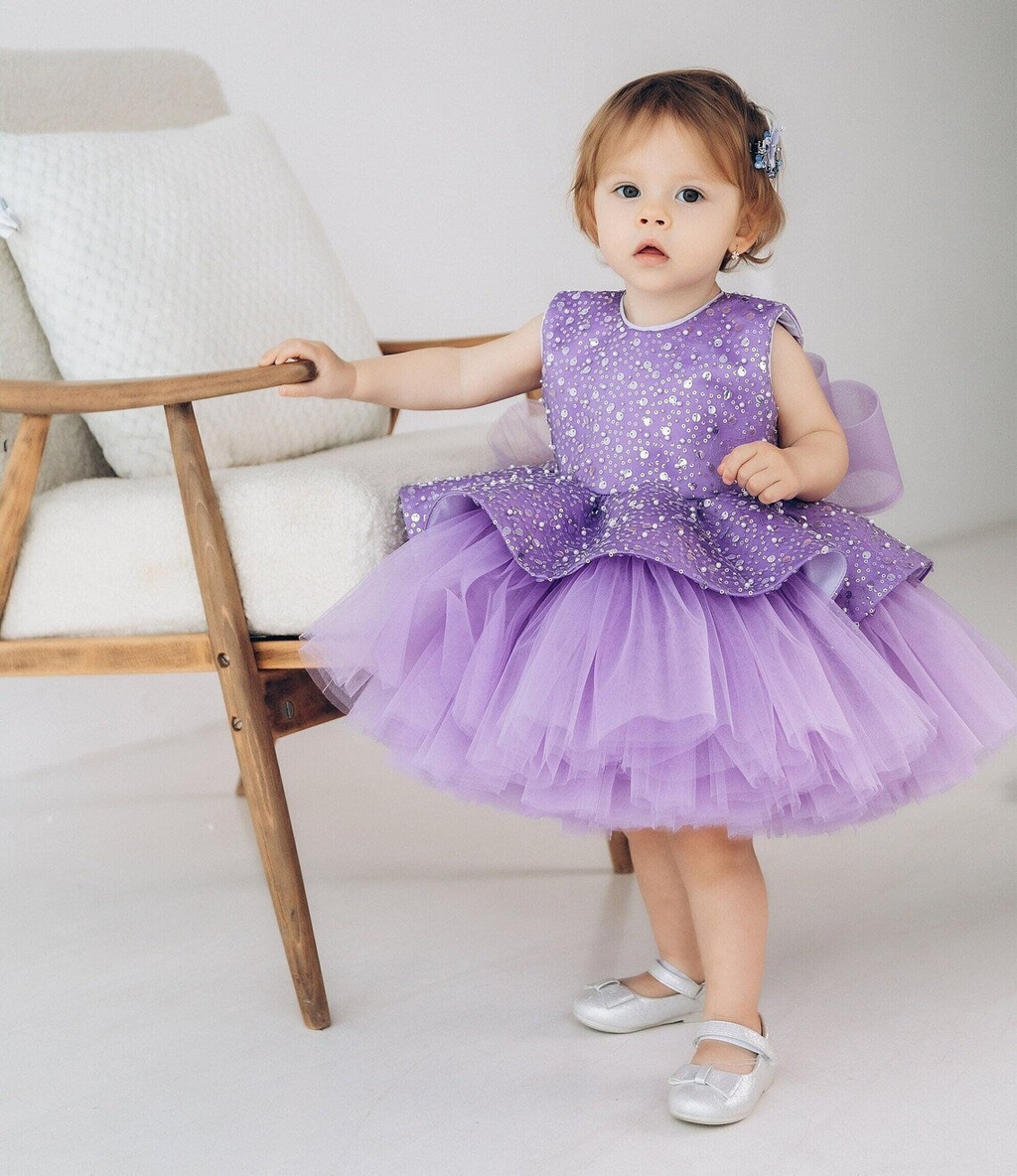 Purple sequin princess dress for toddlers with a structured peplum waist and fluffy layered tulle skirt