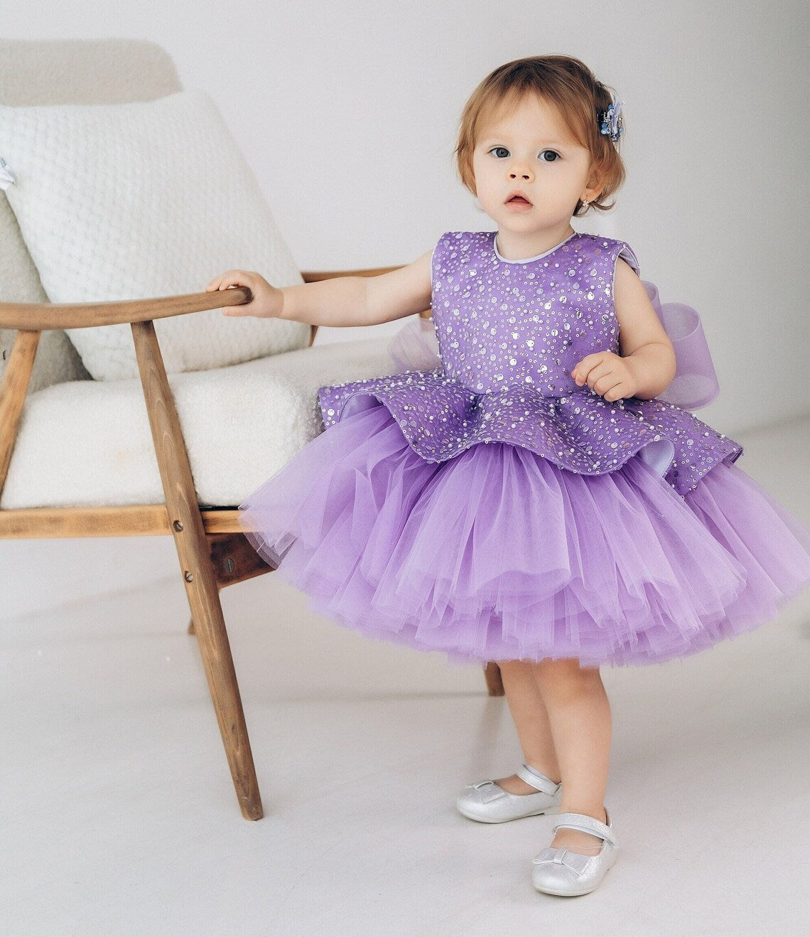 Purple sequin princess dress for toddlers with a structured peplum waist and fluffy layered tulle skirt
