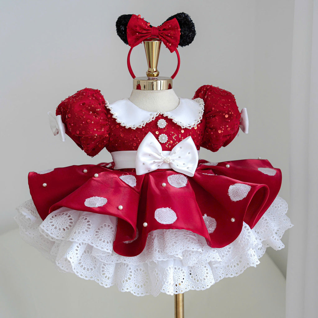 Red polka dot princess dress for girls with sparkling puff sleeves, white collar, pearl accents, waist bow and lace hem
