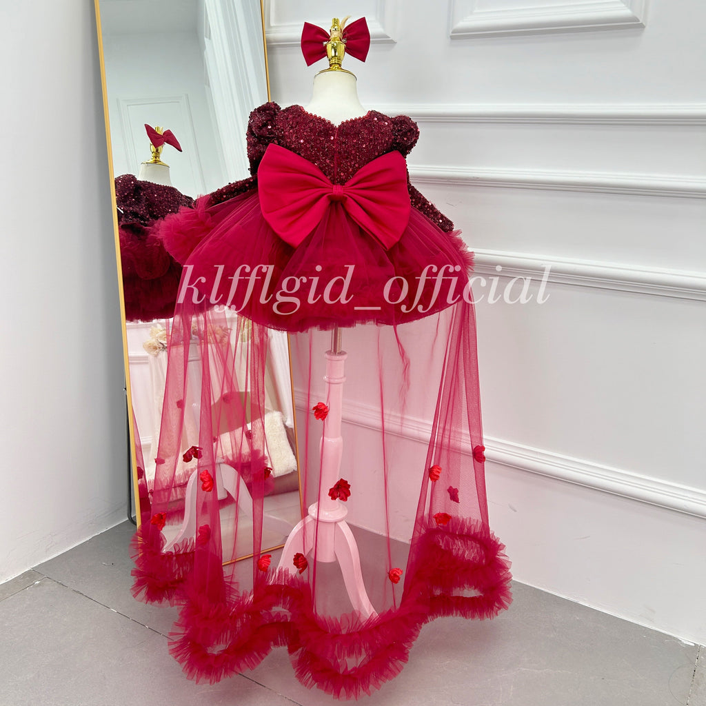 Red princess dress for girls with large back bow and flowing floral tulle panels back view