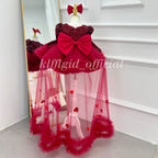 Red princess dress for girls with large back bow and flowing floral tulle panels back view