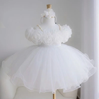 White girls' princess dress with large three-dimensional floral bodice decorations, pearl-style shoulder straps, and a voluminous layered tulle skirt.
