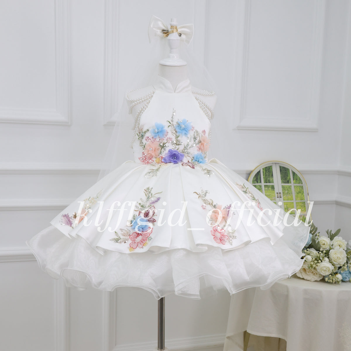 White girls princess dress with colorful 3D floral embroidery, pearl shoulder chains and a full satin skirt